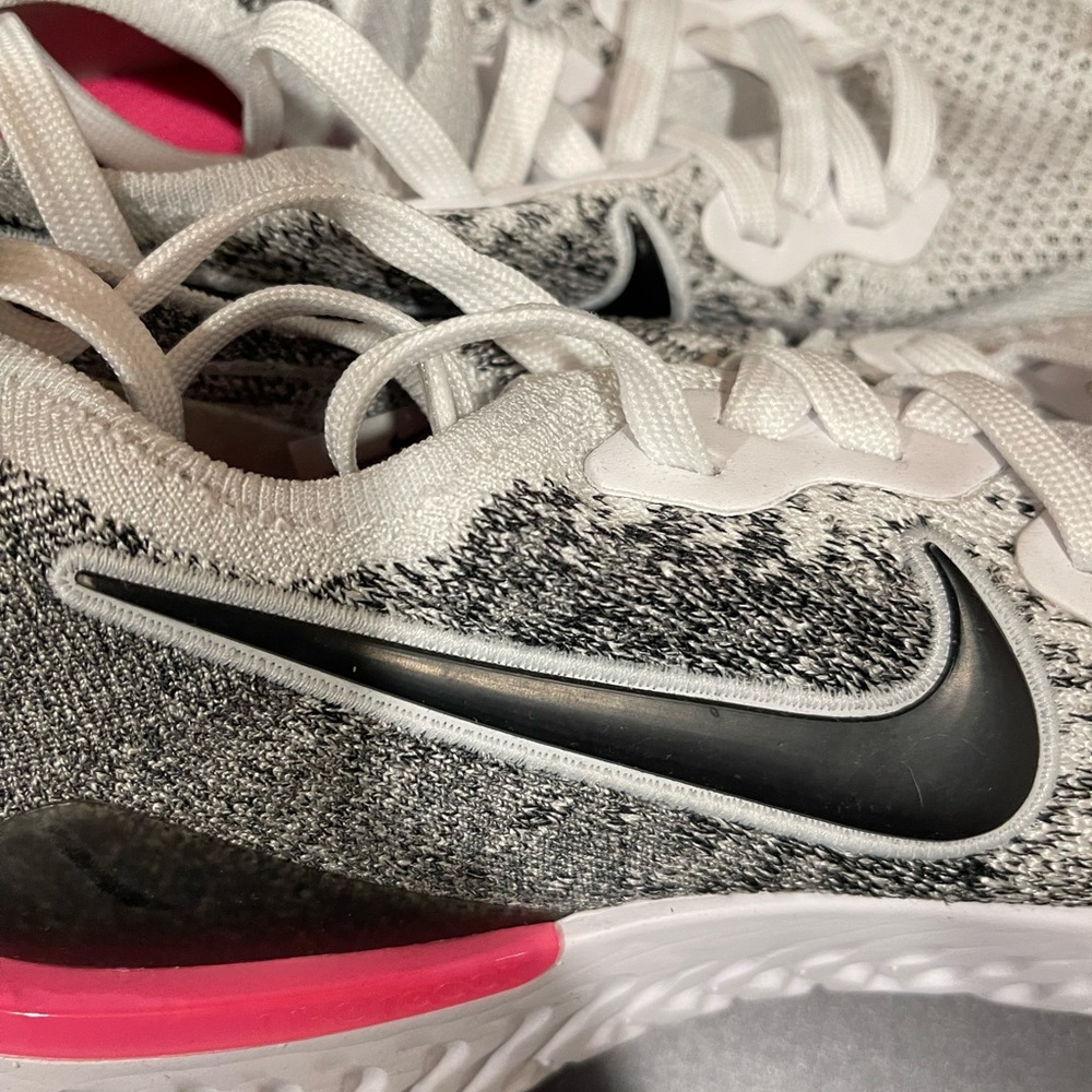 Nike running shoes. Lightweight tennis shoes. Size 9.  Color - black and white.